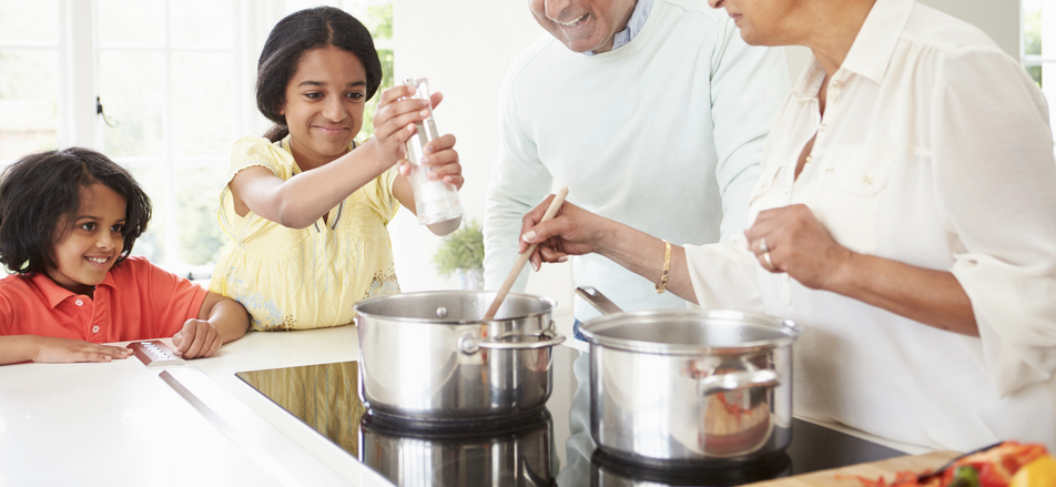 Family cooking with induction cooktop